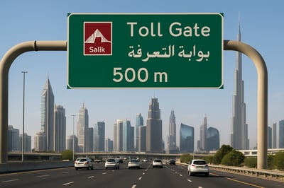 Dubai toll road signage and cityscape Dubai toll road signage and cityscape